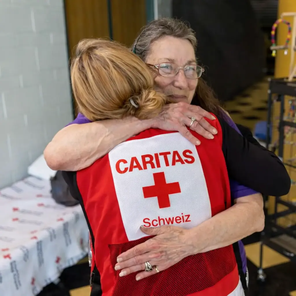 Caritas Italiana volunteer, Tala, smiles at the camera.